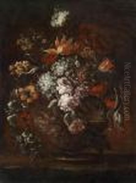 A Large Bouquet Of Flowers In A Globular Glass Vase - view 1