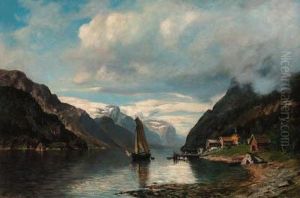 A Sailing Boat In A Rocky Fjord Landscape