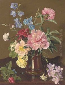 Roses and other summer flowers in a vase on a sideboard