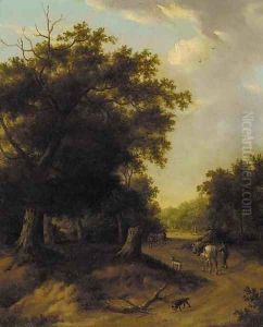A horseman and other figures on a wooded path by Jan Wijnants
