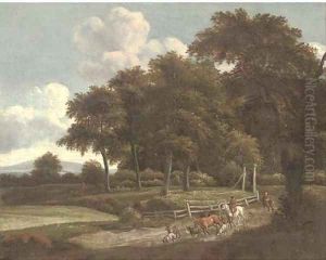 A wooded landscape with a drover and cattle on a track A wooded landscape with a drover and cattle on a track