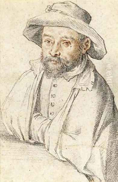 Portrait of a bearded man seated at a table - view 1