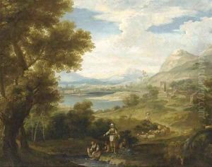 An extensive landscape with shepherdesses and washerwomen by a lake