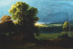 Storm Clouds Over A Lake With A Shaft Of Sunlight Catching The Hills Beyond