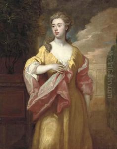 Portrait Of A Lady, 
Three-quarter-length, In A Yellow Dress With Apink Shawl, In A Formal 
Garden By An Orange Tree