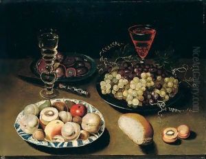 Still Life Of Peaches, Figs, Apples And Walnuts In A Blue And White Porcelain Bowl, Together With Grapes And Plums In Pewter Dishes, Wine Glasses, Bread And A Knife, All Arranged Upon A Table Top