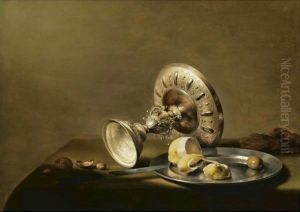 A Still Life With An Overturned Silver Tazza, A Silver Plate With A Partly Peeled Lemon And An Olive, With Walnuts And Hazelnuts