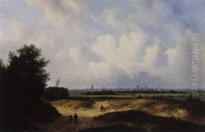 A View Of An Extensive Landscape With Windmills In The Background A View Of An Extensive Landscape With Windmills In The Background