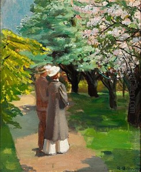 Springtime In The Park. A Young Couple Is Looking At The Blooming Trees - view 1