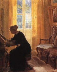 A Woman Sitting At Her Writing Desk