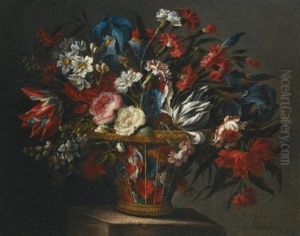 Still Life With Flowers, Including Roses, Narcissi, Peonies, Blue Irises And Variegated Tulips, In A Wicker Basket Set Upon A Stone Plinth by Juan De Arellano