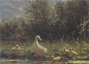 Duck With Her Ducklings On The Riverbank