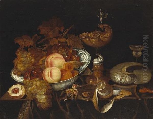 A Still Life Of Fruit In A Blue And White Bowl, A Ewer, A Goblet, A Partially-peeled Lemon And A Nautilus Shell, All Resting On A Partially Draped Table - view 1