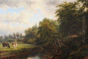 Cattle In A Meadow Beside A Tree-lined River
