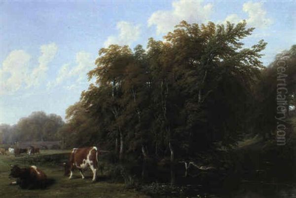 Cattle Grazing On The Banks Of A River - view 1