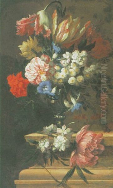 A Still Life Of Carnations, Peonies, Tulips And Other Flowers In A Glass Vase On A Stone Ledge - view 1