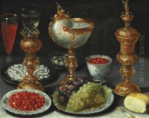 A Lavish Still Life With Fruits On Plates, Gilt Goblet, Nautilus Cup And A Glass Of Wine