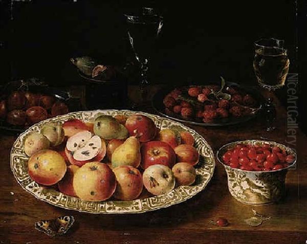 A Still Life Of Apples, Peaches And Pears In A Wan-li Porcelain Dish, Red Grapes, Plums, Raspberries, Figs, Glasses And A Butterfly On A Wooden Table Top - view 1