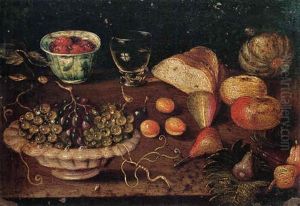 Still Life Of A Bowl Of Grapes And Raspberries In A Blue And White Cup, Together With Other Fruits, Bread And A Glass Of Wine by Osias, the Elder Beert