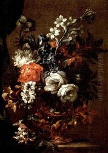 Circle Of Flowers In A Bronze Decorated Glass Vase On A Partially Draped Stone Ledge