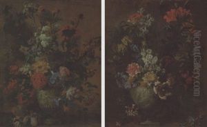 Carnations, Lilies, Delphinium, Chrysanthemums And Other Flowers In A Sculpted Urn On A Ledge