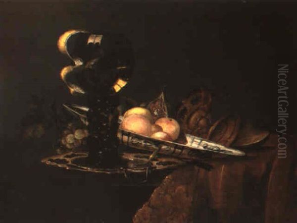 A Still Life Of Fruit In A Dish With Other Objects On A Partly Draped Table - view 1
