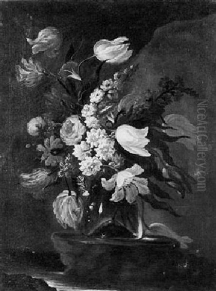 A Still Life Of Assorted Flowers Including Tulips, Narcissae And Stocks In A Glass Vase Upon A Stone Plinth... - view 1
