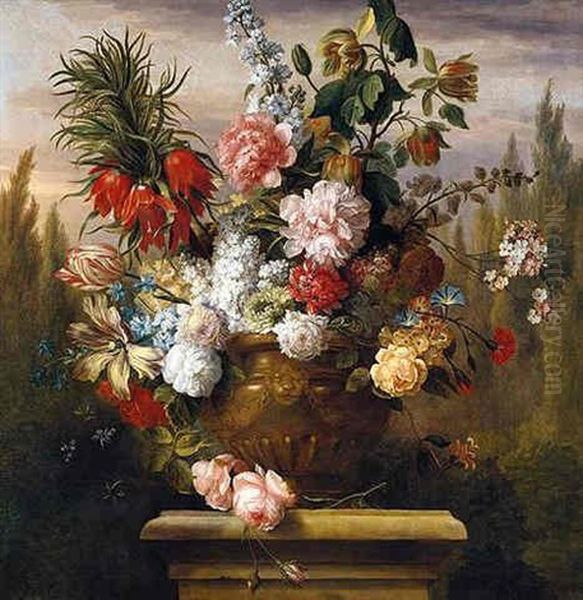 Still Life Of Tulips, Chrysanthemums, Roses, Carnations, Stocks, Honeysuckle And Morning Glory In A Sculpted Urn Upon A Stone Plinth, In A Garden Setting - view 1