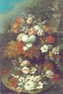 Blumenarrangement Vor Einem Steinernen Brunnen In Einer Parklandschaft