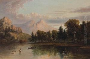 A Lone Figure In A Rowboat With Mountains Beyond