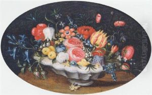Mixed Flowers In A White Glazed Earthenware Bowl On A Table Mixed Flowers In A White Glazed Earthenware Bowl On A Table