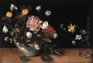 A Still Life Of Flowers In A Bowl And In A Glass Vase by Jan Brughel
