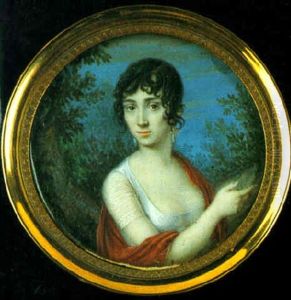 A Lady Wearing Decollete White Dress With Gauze Sleeves, Red Stole And Drop Earings