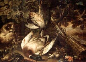 A Spaniel Guarding Over A Duck, A Partridge And Smallbirds, Together With A Musket Resting Against A Tree by Baldassare De Caro