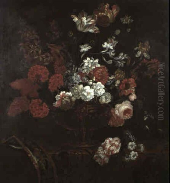 A Still Life Of Tulips, Roses, Pelargonium, Irises And Other Flowers In A Copper Vase On An Embroidered Cloth - view 1