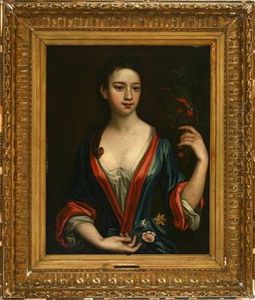 Young Woman Feeding A Parrot With Cherries