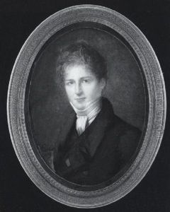 A Young Gentleman With Auburn Hair, Wearing Black Coat, Waistcoat And Tied White Cravat, A Red Ribbon Pinned To His Lapel