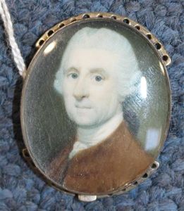 Miniature Of A Gentleman Wearing A Brown Jacket