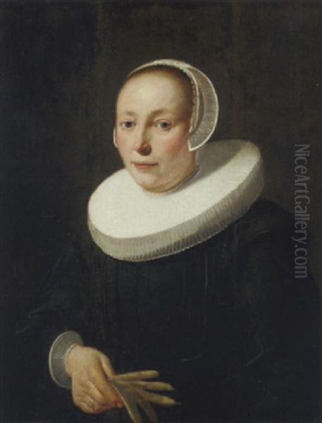 Portrait Of A Lady In A Black Dress And Molenkraag, A White Bonnet And Lace Cuffs, A Pair Of Gloves In Her Hand - view 1