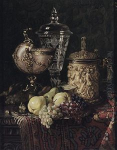 Stilleben Mit Gefasstem Vermeil-nautiluspokal, Elfenbeinhumpen Und Glasernem Deckelpokal, Fruchten Auf Teller Und Orientteppich by Ernst Czernotzky