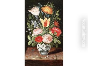 Tulips, Roses, Narcissi And Other Flowers In A Vase On A Table Top
