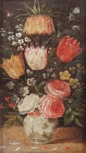 Tulips, Roses, Forget-me-nots And Other Flowers In A Blue And White Porcelain Vase On A Table by Andries Daniels or Danielsz