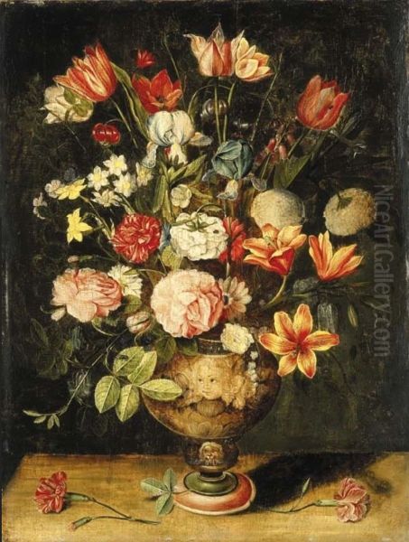 Tulips, Irises, Roses, Carnations, Lilies, Narcissi And Other Flowers In A Sculpted Urn On A Table - view 1