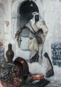 Homme Arabe Pres De La Porte Voutee by Ludwig Deutsch
