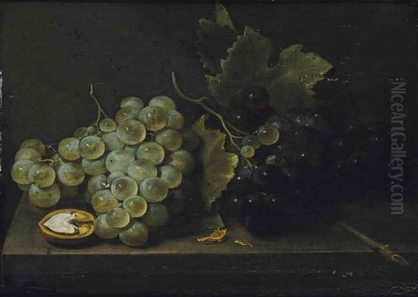 White And Red Grapes With An Open Walnut On A Stone Ledge - view 1