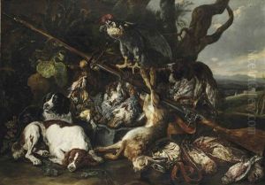 A Hunting Still Life Of A Hare, Partridges, Snipes And Other Birds, Together With Three Spaniels, A Hooded Falcon, A Rifle And A Game-bag And Belt In A Hilly Landscape by Jan Fyt