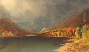 Serene Autumnal Lakeside Scene With Snowcapped Mountains In The Distance And Storm Approaching