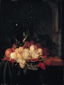 Still Life Of A Roemer And A Wine Glass Together With Cherries, Peaches, Grapes, Redcurrants, Oranges And A Lemon, Arranged On A Silver Plate On A Wooden Ledge Draped With A Green Cloth