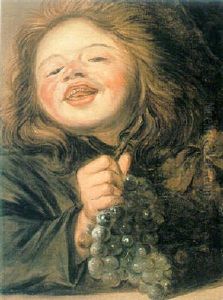 A Boy Holding A Bunch Of Grapes A Boy Holding A Bunch Of Grapes