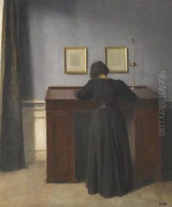 Ida Standing At A Desk by Vilhelm Hammershoi